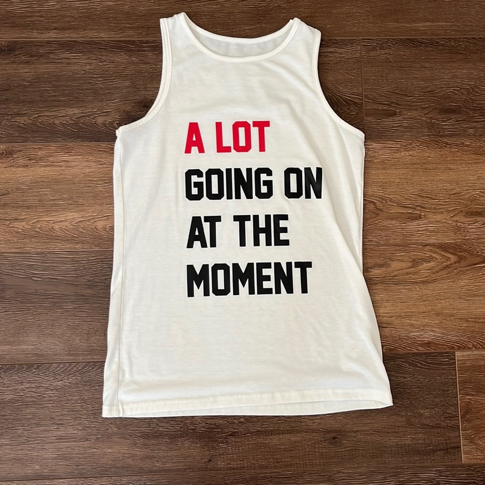 Taylor Swift tank top. Size small but runs like a medium.